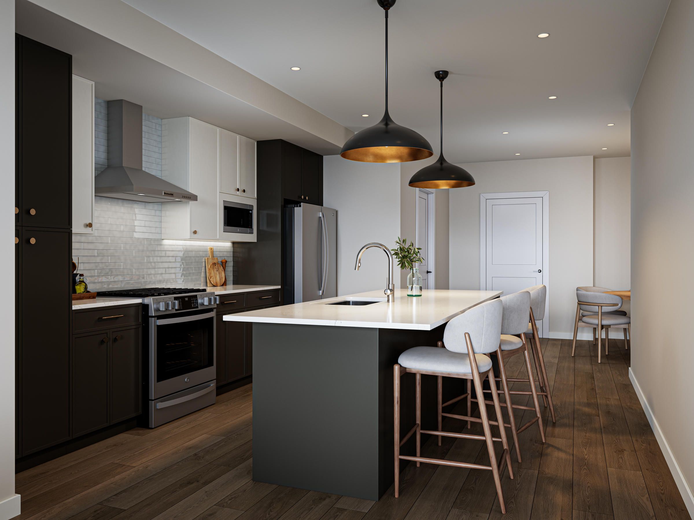 Modern kitchen with island, pendant lights, bar stools, stainless steel appliances, and wood flooring.